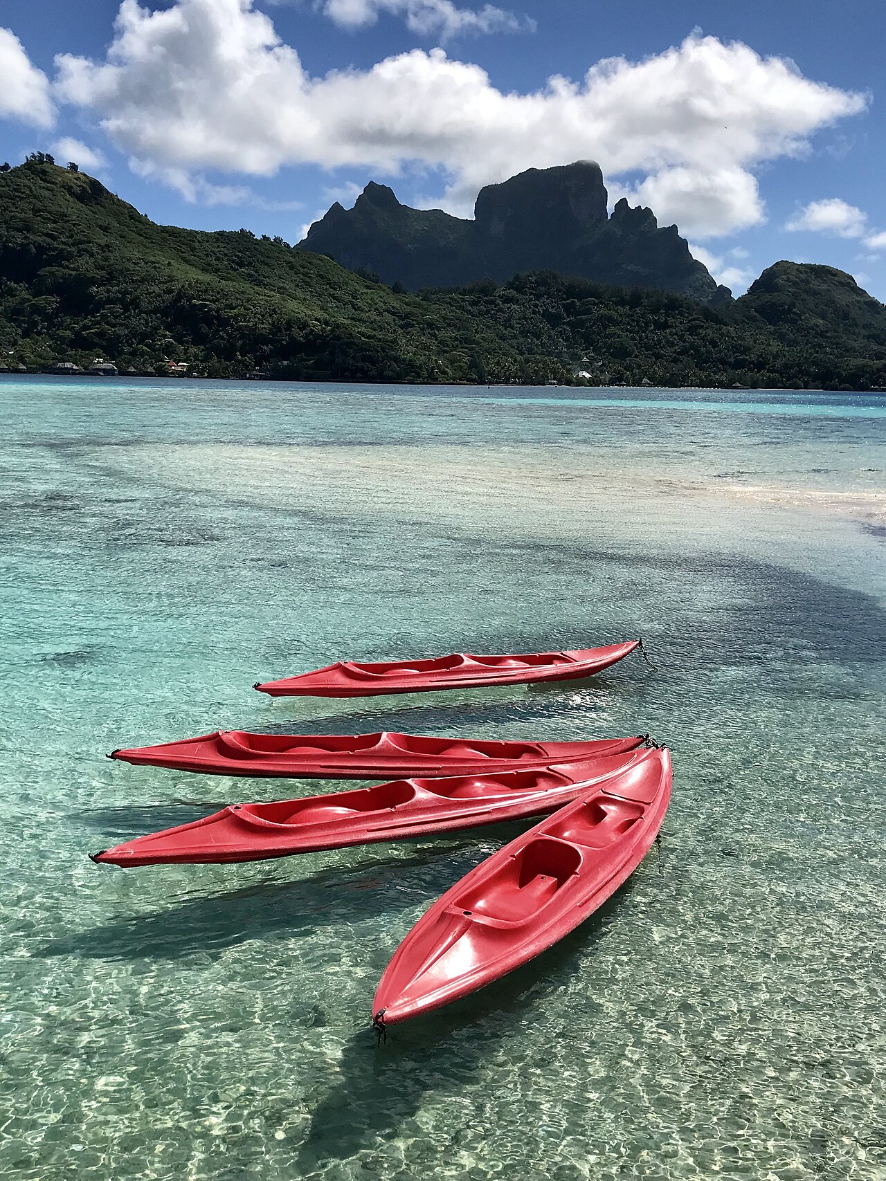 Fishing boat in the lagoon near Bora Bora's central peak